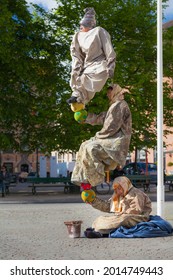 Bruges, Belgium - May 20 2017: Amazing Street Magic Show, Levitating Man Is Street Entertainer At Market Square 