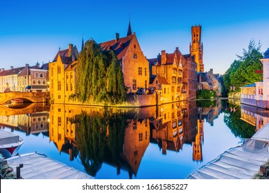Bruges, Belgium. The Rozenhoedkaai canal in Bruges with the Belfry in the background.