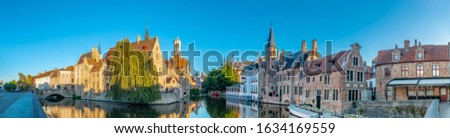 Bruges Belgium vintage stone houses and bridge over canal ancient medieval street picturesque landscape, Bruges, Belgium. 