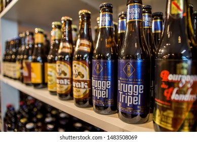 Bruges, Belgium,15/05/2019 European Beer Wine Shop Store Rows Upon Rows Bottles Of Alcohol Labels Marketing Alcoholic Central Brown Bag Ale Lager Spirits IPA Independence Brewer Brewery 