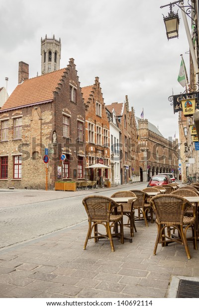 BRUGGE,\
BELGIUM - APRIL 22:Sidewalk on the old street in the historic part\
of town on april 22, 2013 in Burgge. Bruges historic center is a\
UNESCO World Heritage Site since 200\
year.
