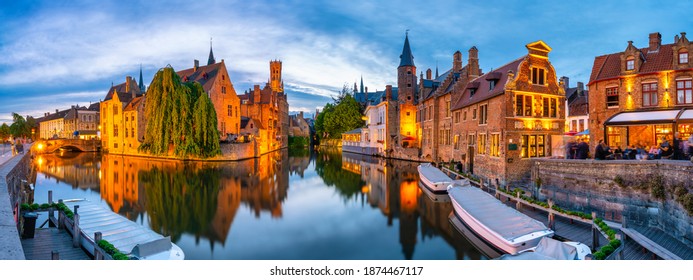 Brugge city centre, often referred to as The Venice of the North, with famous Rozenhoedkaai illuminated in beautiful twilight, West Flanders province, Belgium