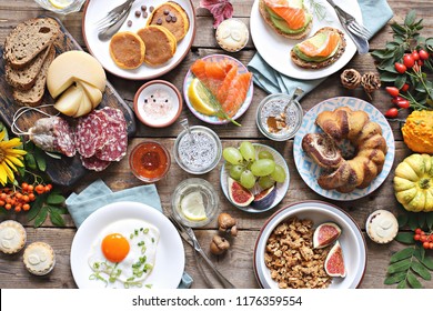 Brunch. Breakfast Food Table. Festive Brunch Set, Meal Variety With Fried Egg, Pancakes, Granola, Sweets And Berries. Overhead View