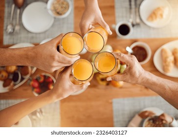 Brunch, hands or people toast with orange juice, beverage or glass drink at lunch, breakfast or food meal. Fruit liquid, top view group or home friends celebrate, support or toasting at reunion event - Powered by Shutterstock