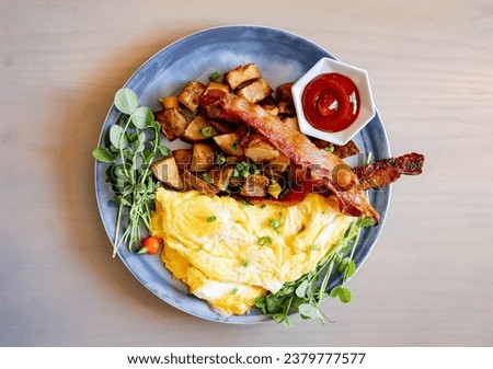 Brunch Omelette with Bacon and Ketchup at Upscale restaurant