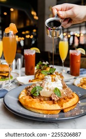 Brunch spread in restaurant with bloody mary and mimosa