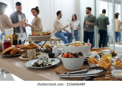 Brunch Table Setting With Different Delicious Food	And Blurred View Of People On Background