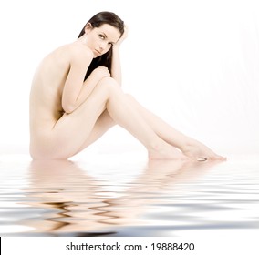 Brunette beauty nude sitting in pool of water