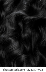 Brunette or black hair. Female long dark hair in black. Beautifully laid curls. Closeup texture in a dark key. Hairdressing, hair care and coloring. Shading gray hair. Background with copy space. - Shutterstock ID 2241974993