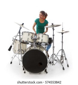 Brunette Brazilian Woman Has Fun Playing The Drums In Studio Against White Background