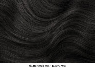 Brunette Or Brown Hair. Female Long Dark Hair In Black. Beautifully Laid Curls. Closeup Texture In A Dark Key. Hairdressing, Hair Care And Coloring. Shading Gray Hair. Background With Copy Space.