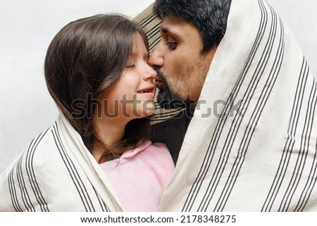 Similar – Image, Stock Photo Happy couple laughing and covering mouths under duvet