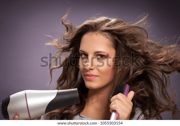 Brunette Girl Blow Drying Her Long Stock Photo Edit Now 1055503154