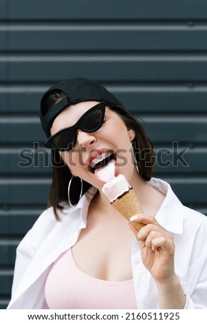 Similar – Image, Stock Photo Young and blonde woman holding a strawberry ice cream