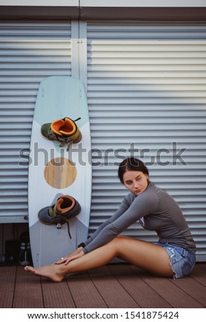 Similar – Surfer woman with bikini and wetsuit holding surfboard