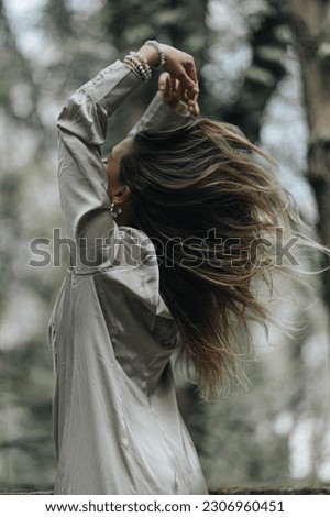 Similar – Image, Stock Photo Cool blonde woman performing dancing at sunset and raising the hand close to her head