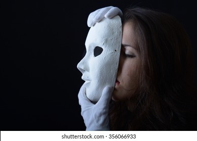 Brunette Girl Is Holding A Theatrical Mask