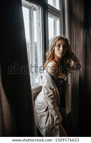 Similar – Woman looking from her balcony the city