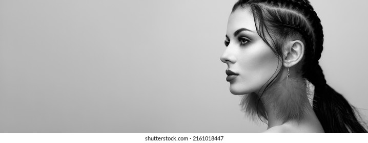 Brunette girl with perfect makeup. Beautiful model woman with curly hairstyle. Care and beauty hair products. Lady with braided hair. Model with jewelry. Black and White photo - Powered by Shutterstock