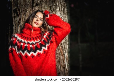 Brunette Girl Wearing Fuzzy Mohair Wool Red Sweater In Woods