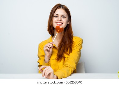 brunette with a lollipop
