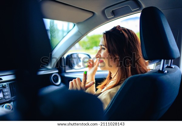 brunette middle age student woman in new car outdoor
summer day