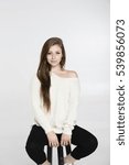 Brunette model posing in a studio environment