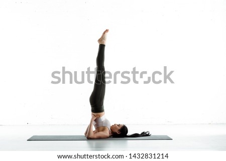 Similar – Image, Stock Photo young caucasian woman doing fitness on mat at home