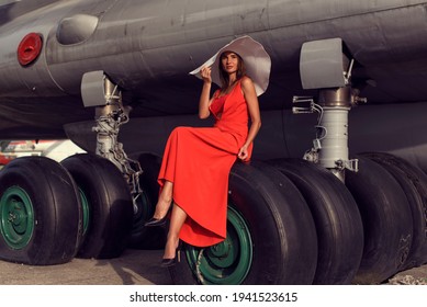 Brunette Woman At The Airfield