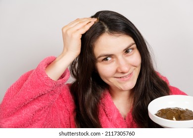 A Brunette Woman Applies A Natural Ayurvedic Blend Of Herbs To Her Hair, Scalp Mask And Scrub, Hair Care At Home.