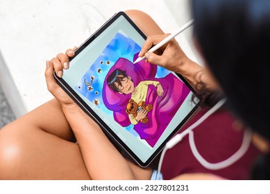 Brunette woman artist and illustration drawing, using electronical tablet and stylus, by using touchscreen