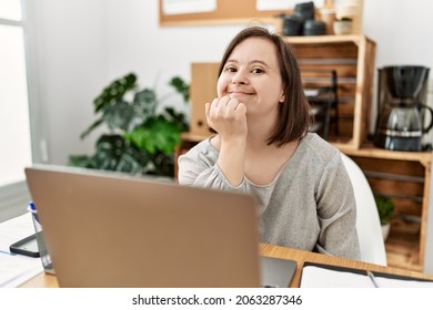 Brunette Woman With Down Syndrome Working At Business Office