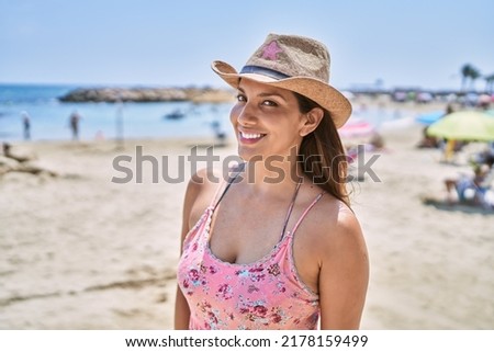 Brunette woman enjoying a summer day at the beach