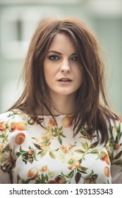 Brunette Woman With Messy Hair Outdoor Portrait