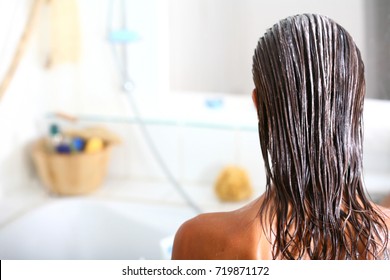 Brunette Woman With A Nourishing Mask On Her Hair
