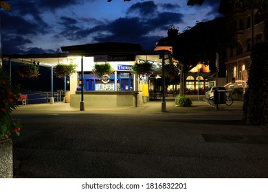 Brunnen, Switzerland - September 01, 2020: There Is A Small Ticket Office Building Well Lit Around Which It Is Now Empty. It Is Already Very Dark Around.