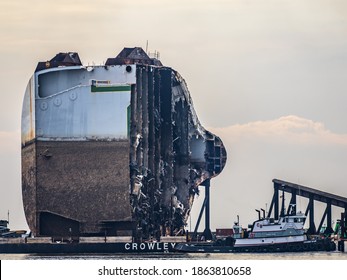 BRUNSWICK, GEORGIA USA - November 29, 2020: The first large dismantled segment of the capsized ship Golden Ray is pushed on a barge to Brunswick for further dismantling.