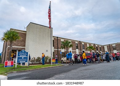 BRUNSWICK, GEORGIA / USA - October 12, 2020: The first morning of early voting in Georgia began with lines at the Brunswick polling station and candidates' boosters on the street.