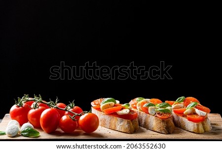 Similar – Image, Stock Photo Bruschetta with cream cheese, cherry tomatoes and basil