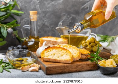 Bruschetta with olive oil, olives, pesto, garlic and parmesan. ciabatta bread with olive oil and spices. Delicacy. Delicious and healthy food. Vegan. Place to copy. copy space. - Powered by Shutterstock