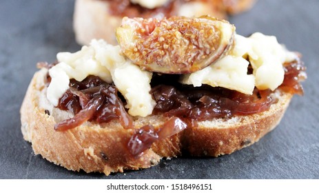  bruschetta sandwich with onion confiture and Camembert cream cheese on a slice of ciabatta bread - Shutterstock ID 1518496151