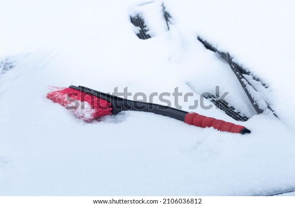 A
brush for cleaning snow from a car.Car
accessories.