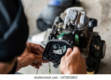Brush cutter engine has been partially disassembled for servicing