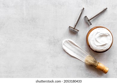 Brush foam shaver and shaving foam in wooden bowl, top view - Shutterstock ID 2053180433