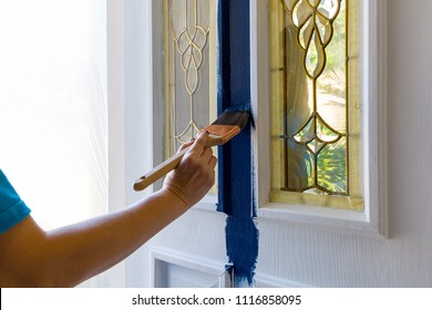 Brush Painting House Front Door With Blue Paint At Home Do It Yourself Project