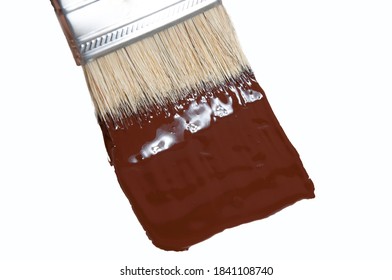 Brush Paints With Brown Paint On A White Background