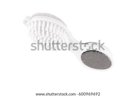 Brush and pumice stone for care of legs isolated on white background. Hygiene of the feet.