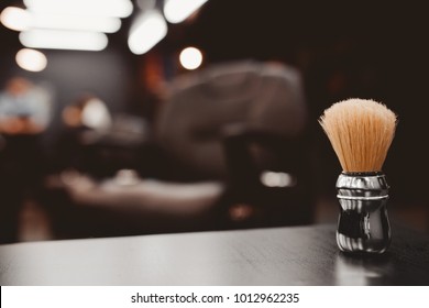 Brush For Shaving Beard Along With Bowl, Blurred Background Of Hair Salon For Men, Barber Shop