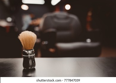 Brush For Shaving Beard Along With Bowl, Blurred Background Of Hair Salon For Men, Barber Shop