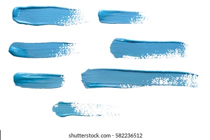Brush Strokes of blue paint isolated on white background. - Shutterstock ID 582236512